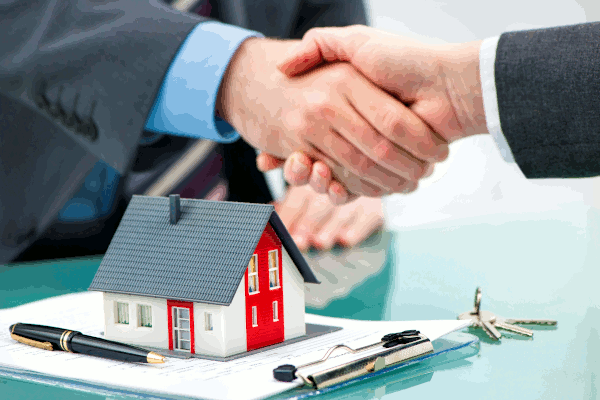 Handshake over a house