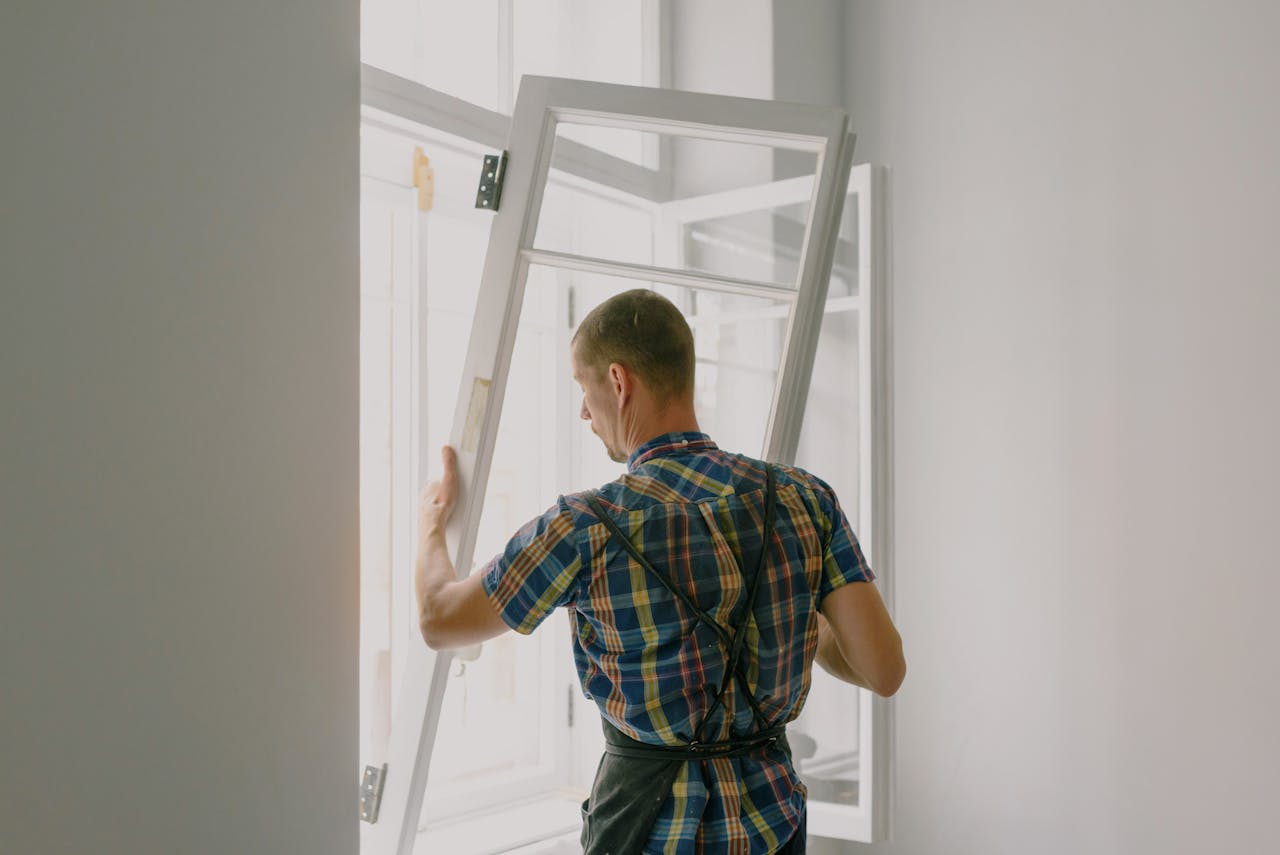 Person intalling a window. Image by Pexels