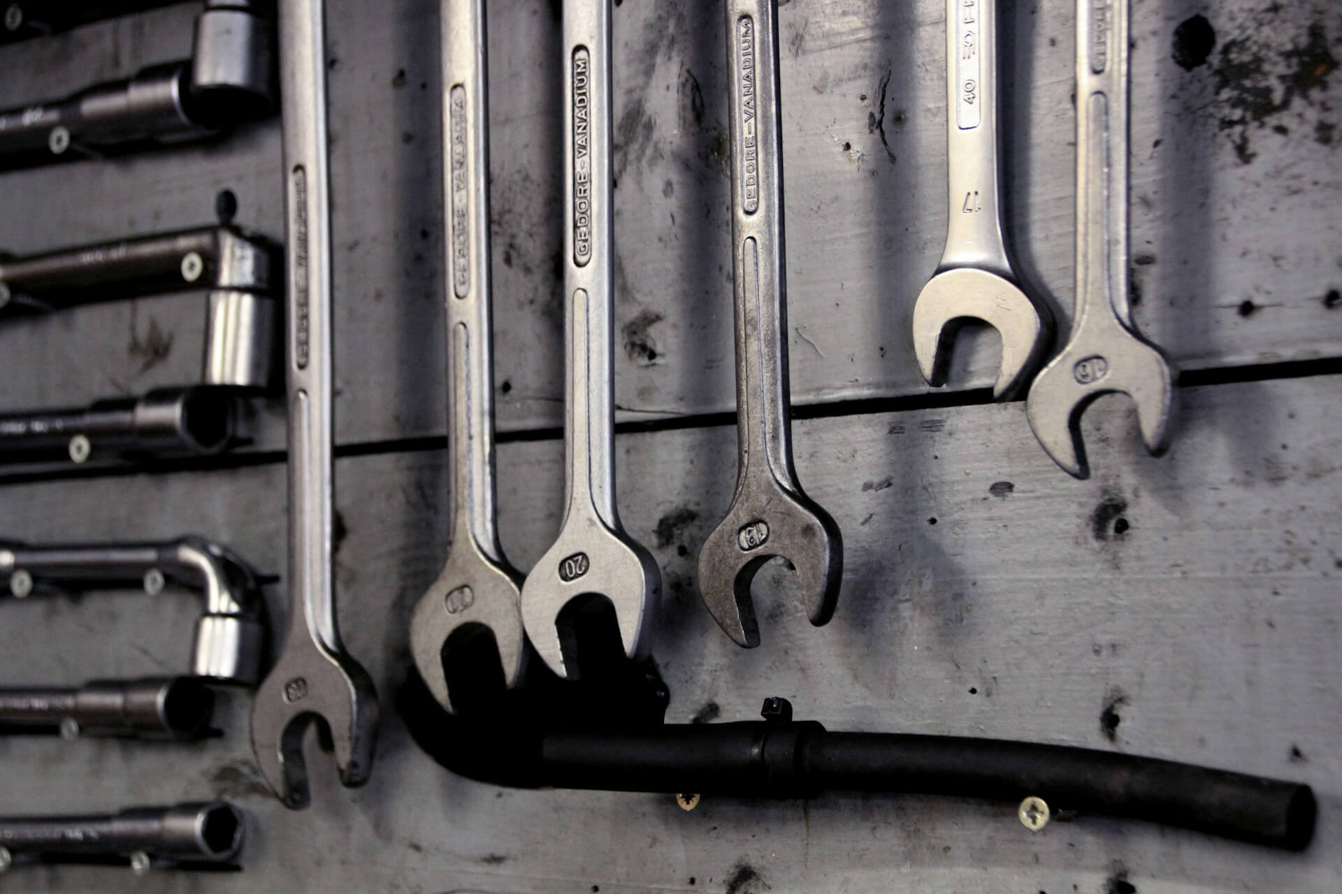 Tools hangin on a wall. Image by Unsplash