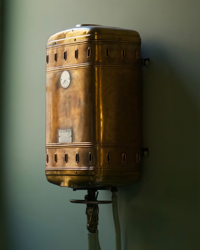 Brown steel container on a green wall. Image by Unsplash