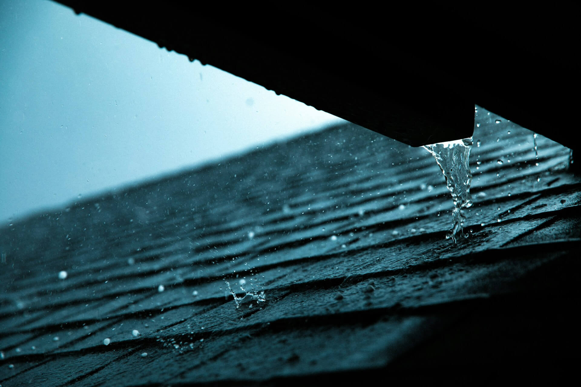 Close-up of a rain gutter on a roof showing potential water damage warning signs. Image by Unsplash