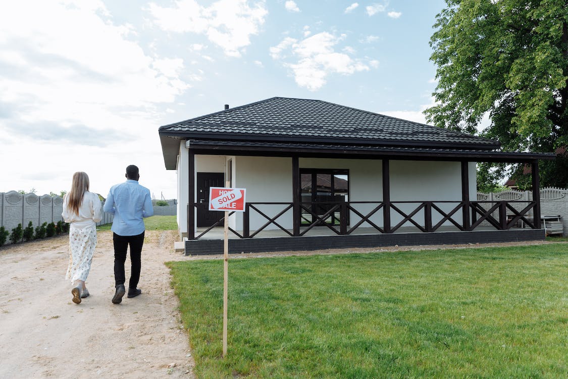 family looking at a house that's sold
