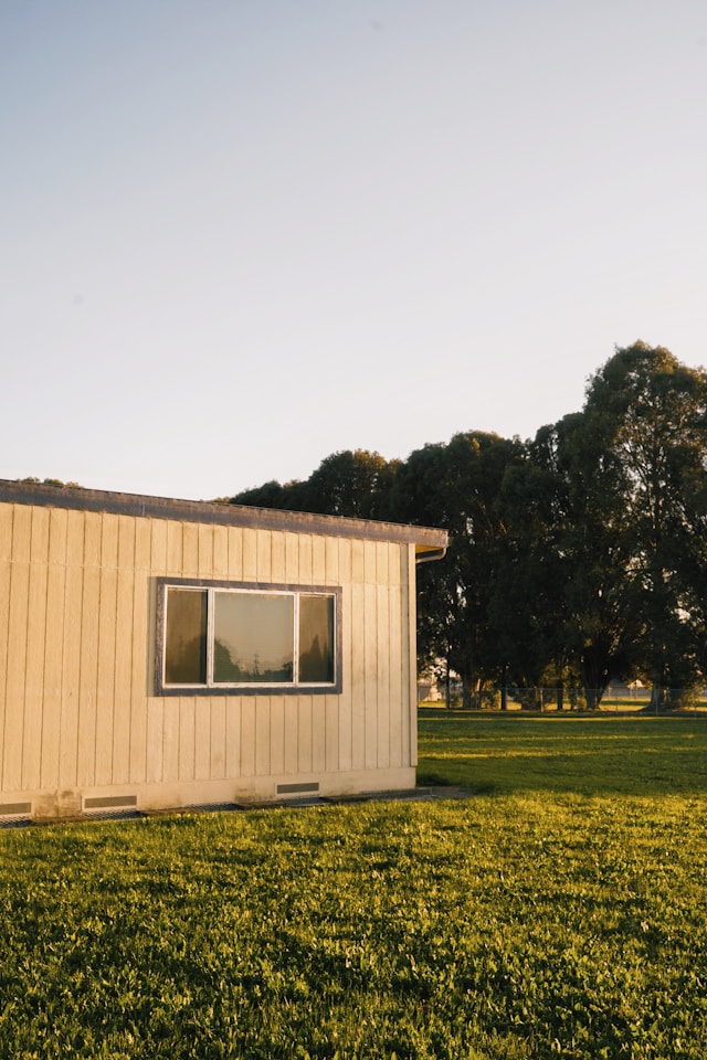 white and brown house near trees. Image by Unsplash