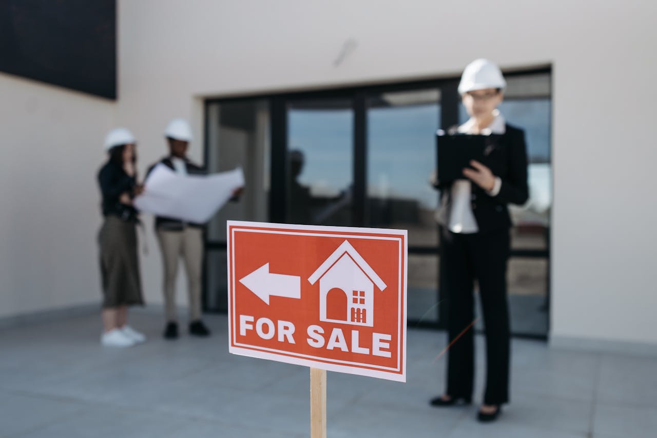 Red for sale sign. Image by Pexels
