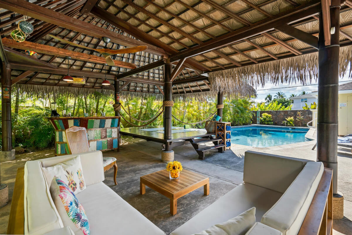 Backyard with pool, deck, patio. Image by Pexels