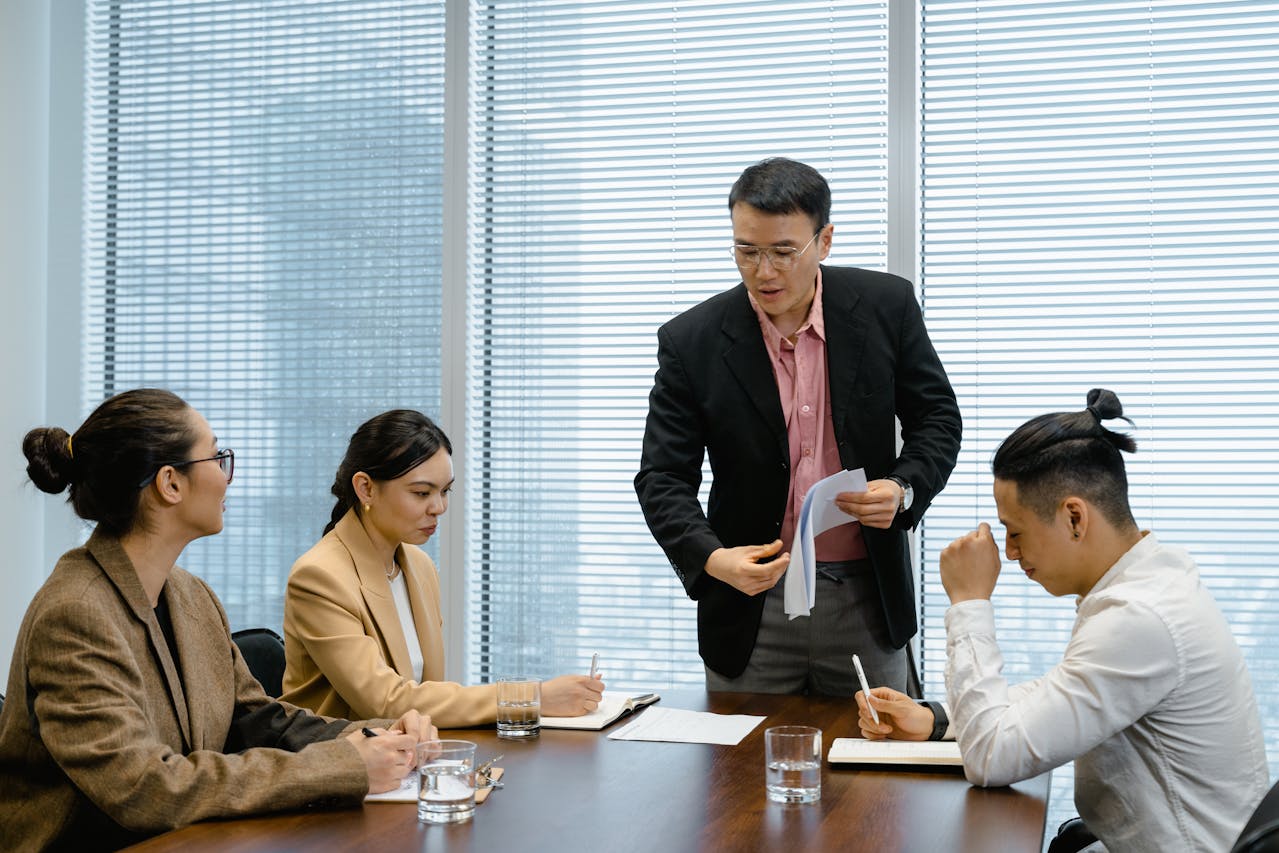People in a meeting. Image by Pexels