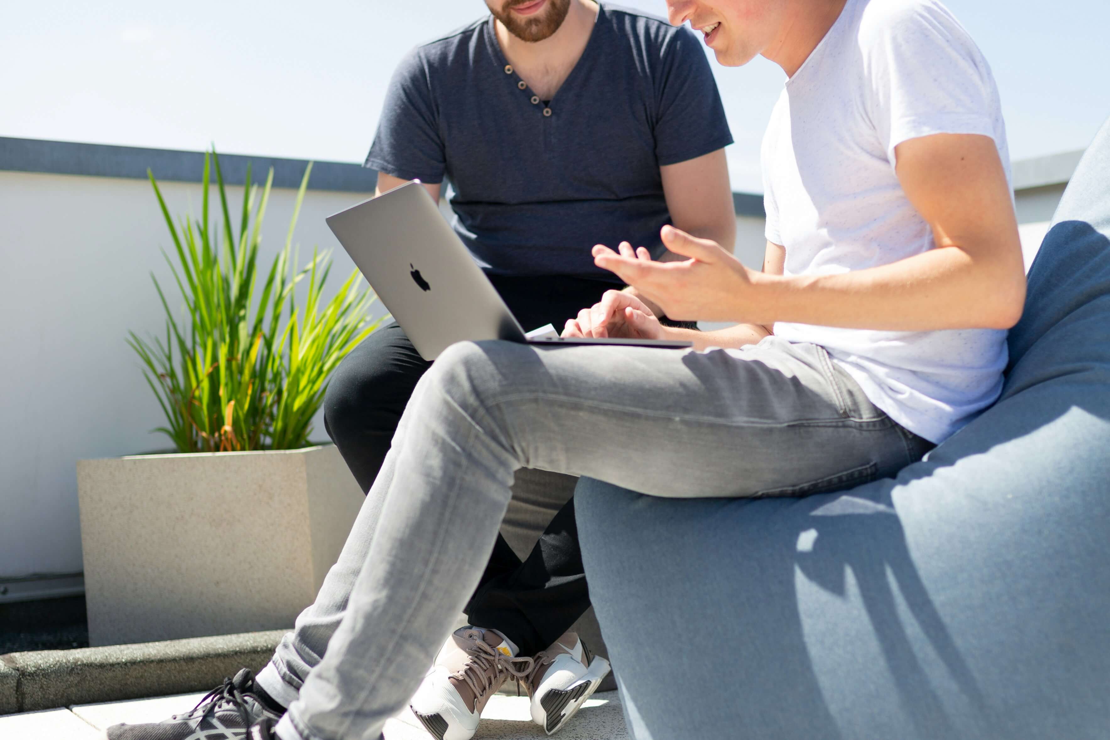 Two professionals utilizing account mapping to enhance customer segmentation. Image by Unsplash