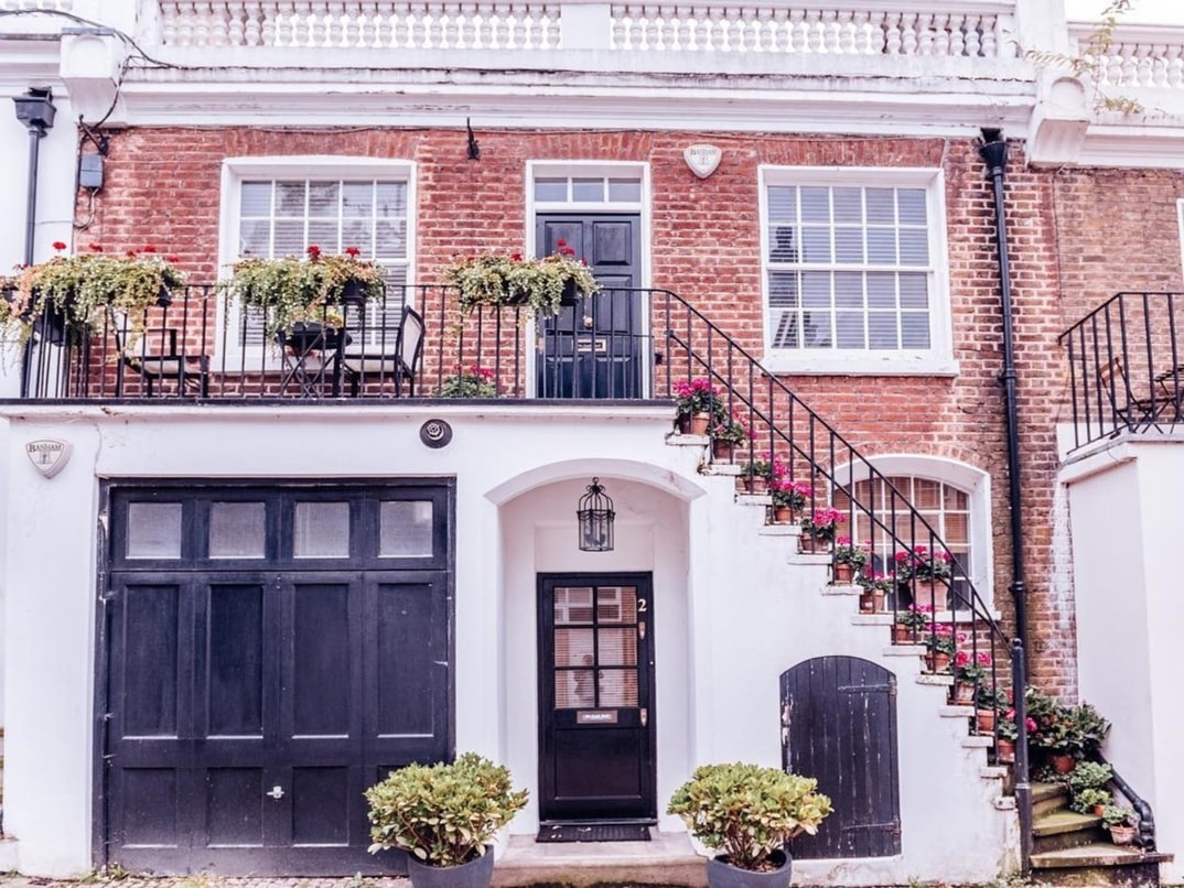 Well-maintained brick house exterior demonstrating the clean appearance achieved through regular pressure washing
