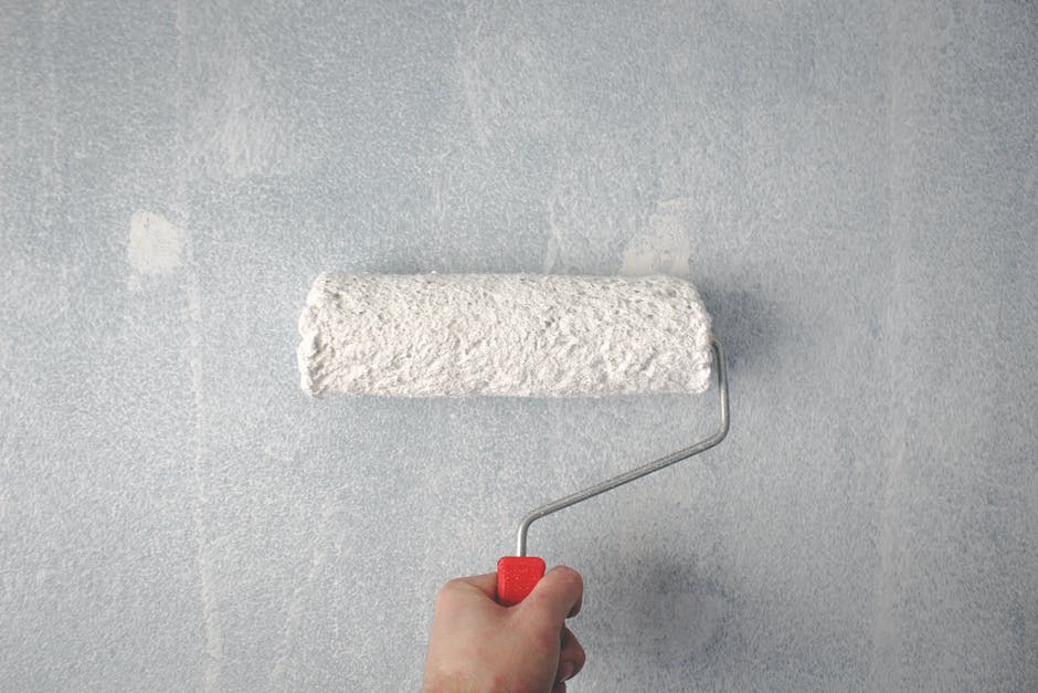 Person painting a room