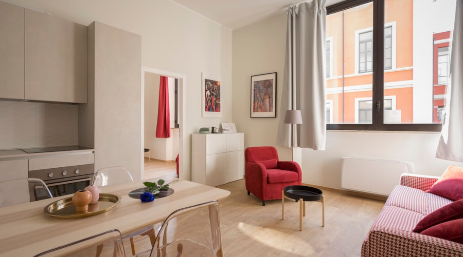 Kitchen, livingroom combo. Red and white furniture